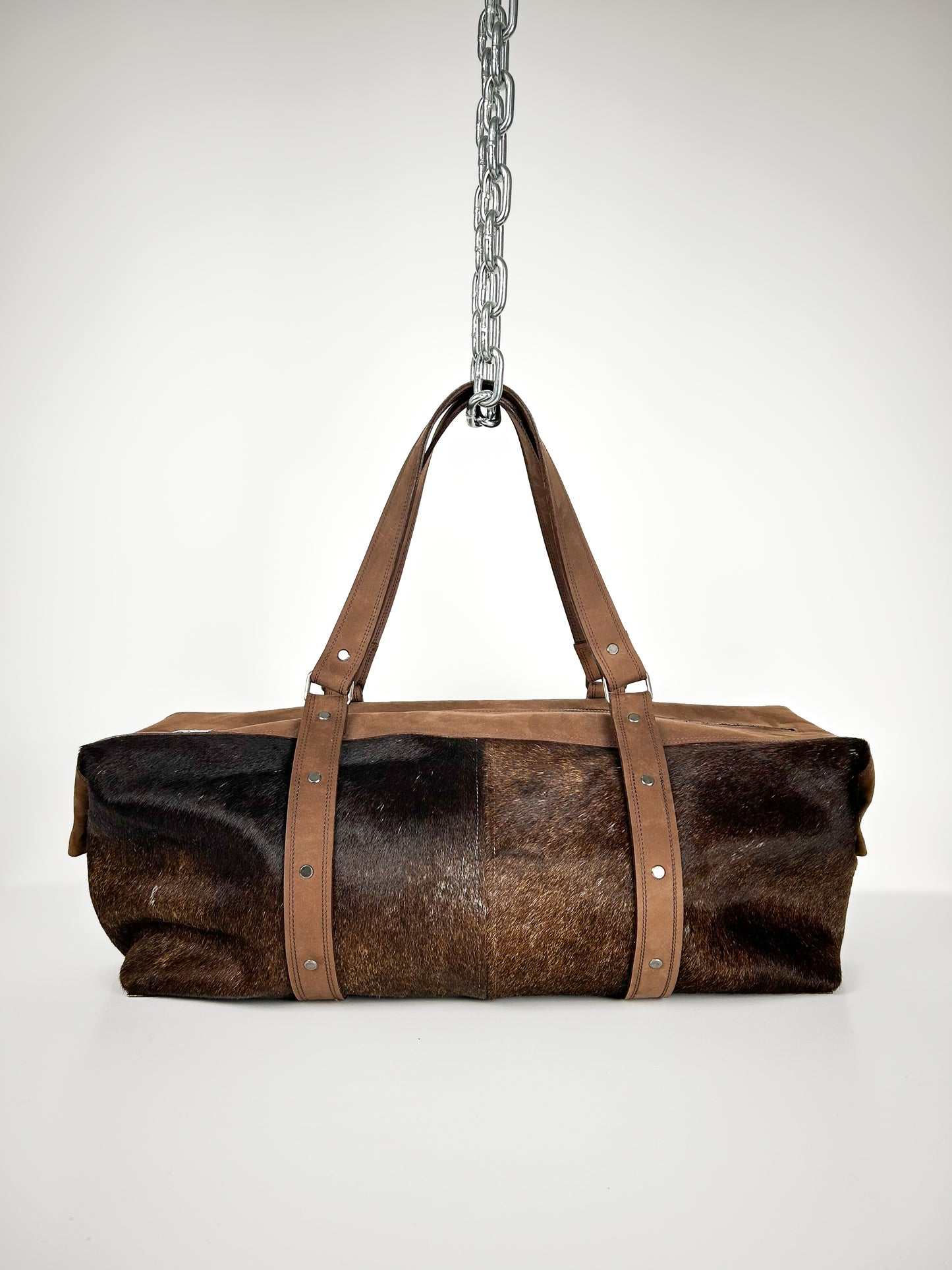 BROWN COWHIDE TRAVEL BAG