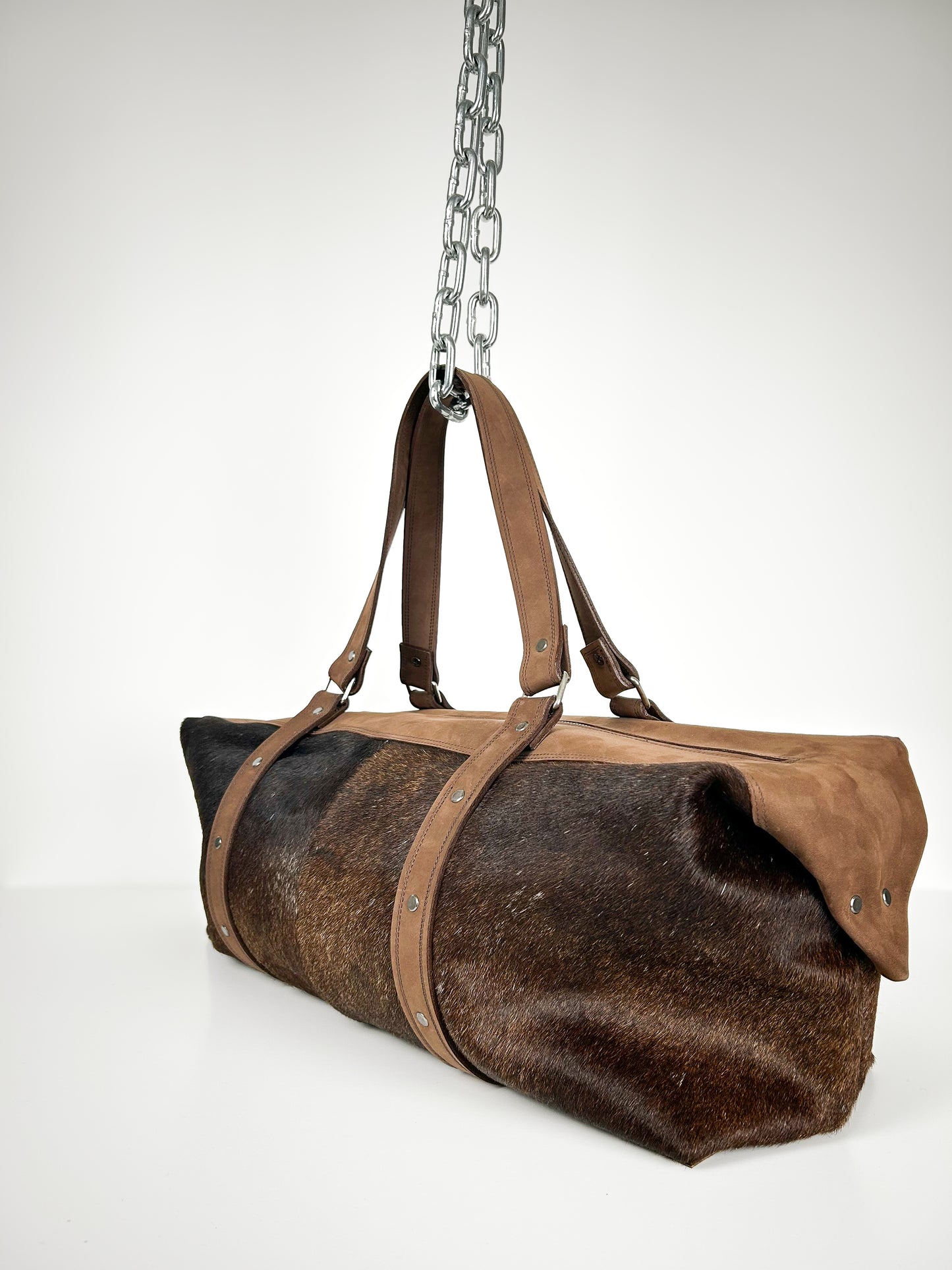 BROWN COWHIDE TRAVEL BAG