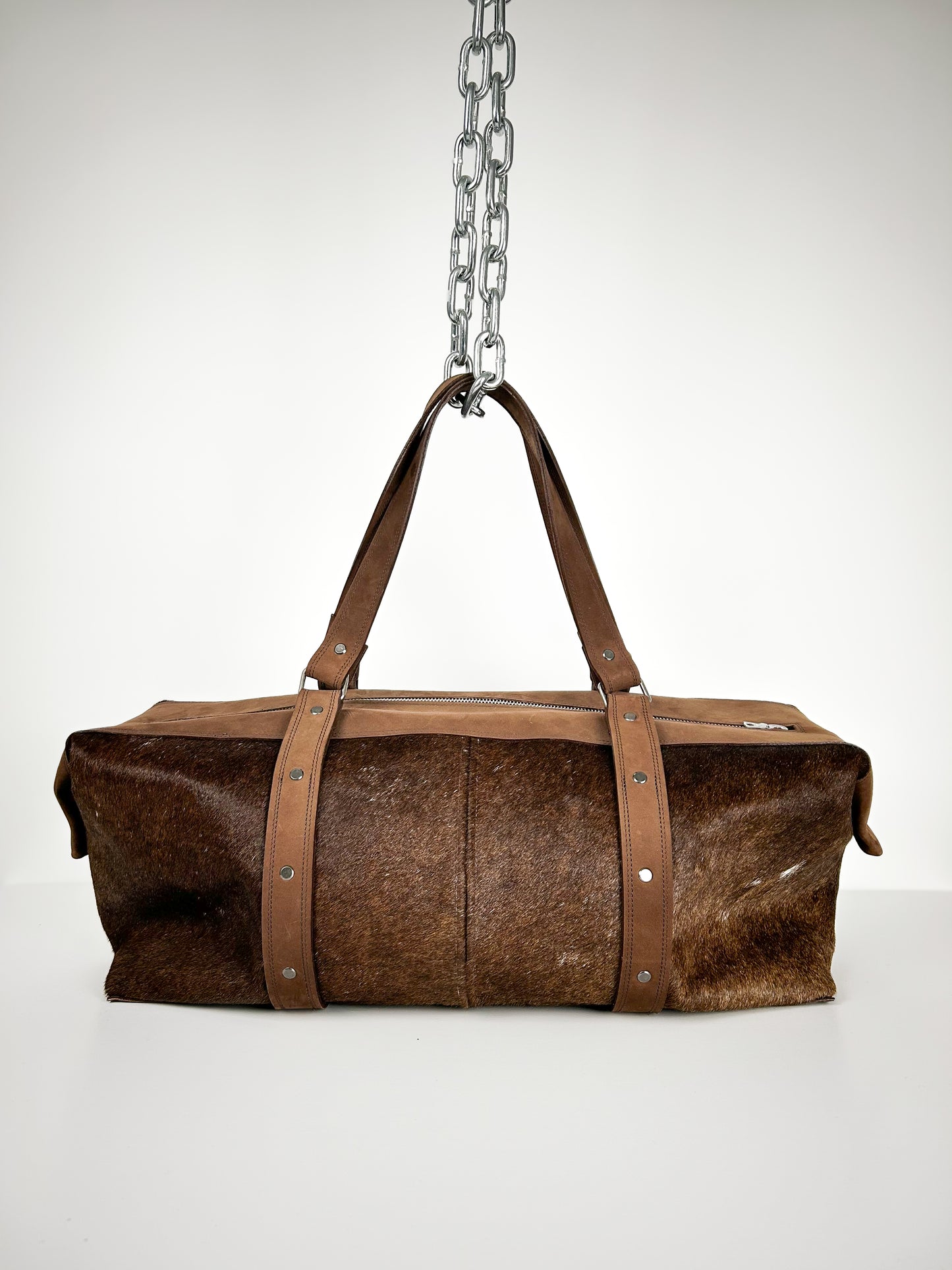 BROWN COWHIDE TRAVEL BAG